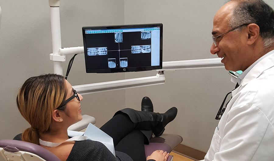 Dr. Marvizi with a dental patient.